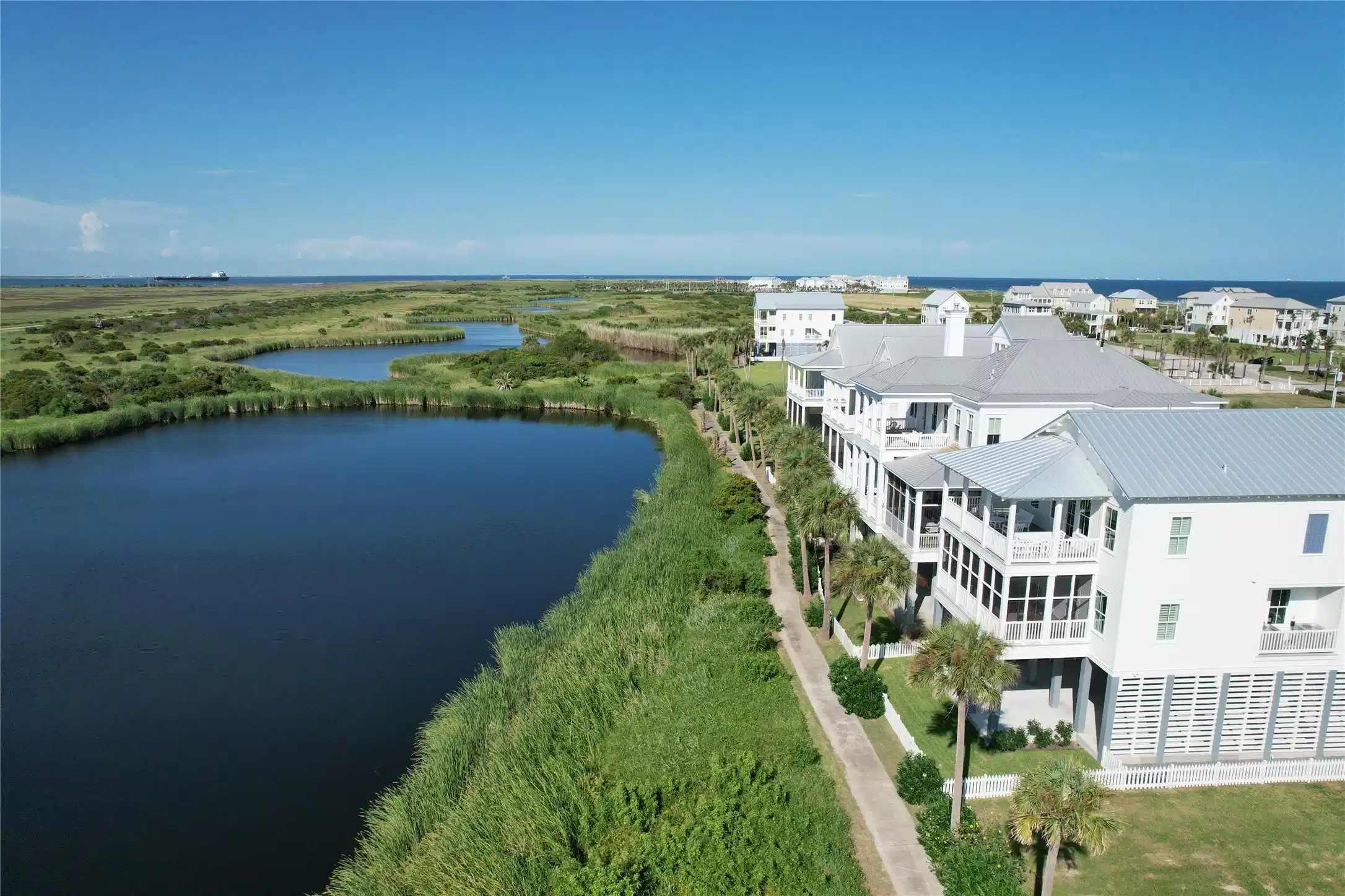 Image 1: Beachtown lagoons with Galveston Bay in the backgr