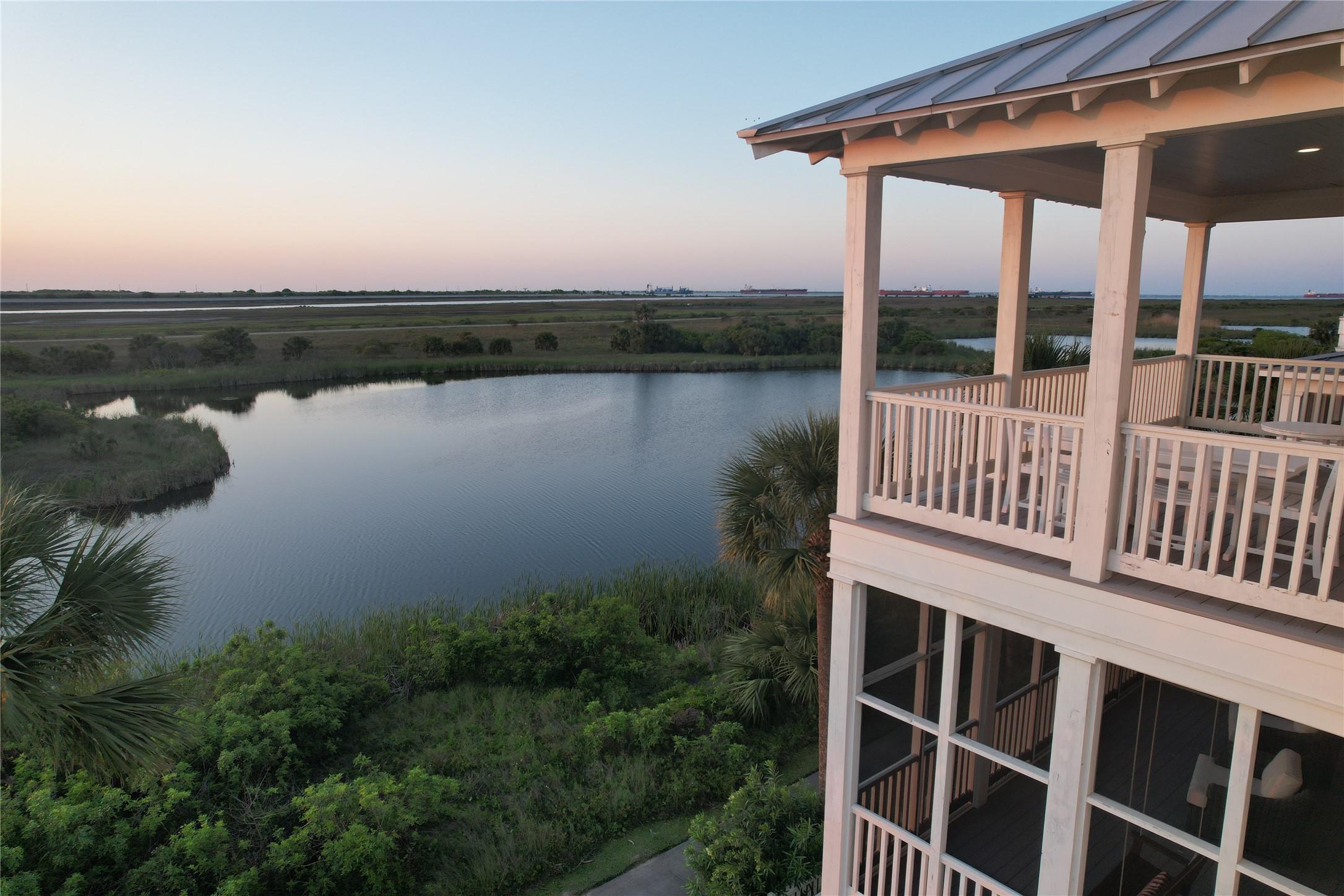 Image 4: Serene lagoon views behind the home