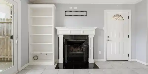 Image 3: Wood burning fireplace.