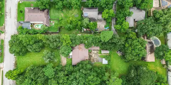 Image 3: Arial view directly above the property with lot on