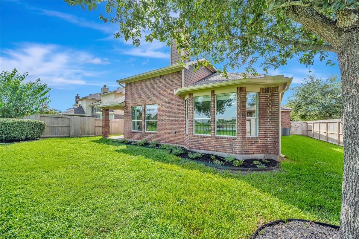 Image 4: Stately brick and relaxing patio on the back of th