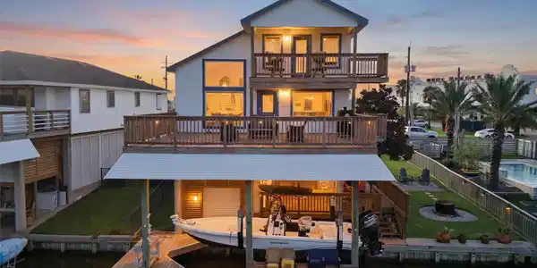 Image 3: Expansive waterfront decks and a private boat lift