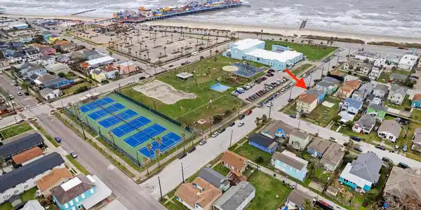 Image 3: Menard Park has 6 tennis courts, a dog park, skate