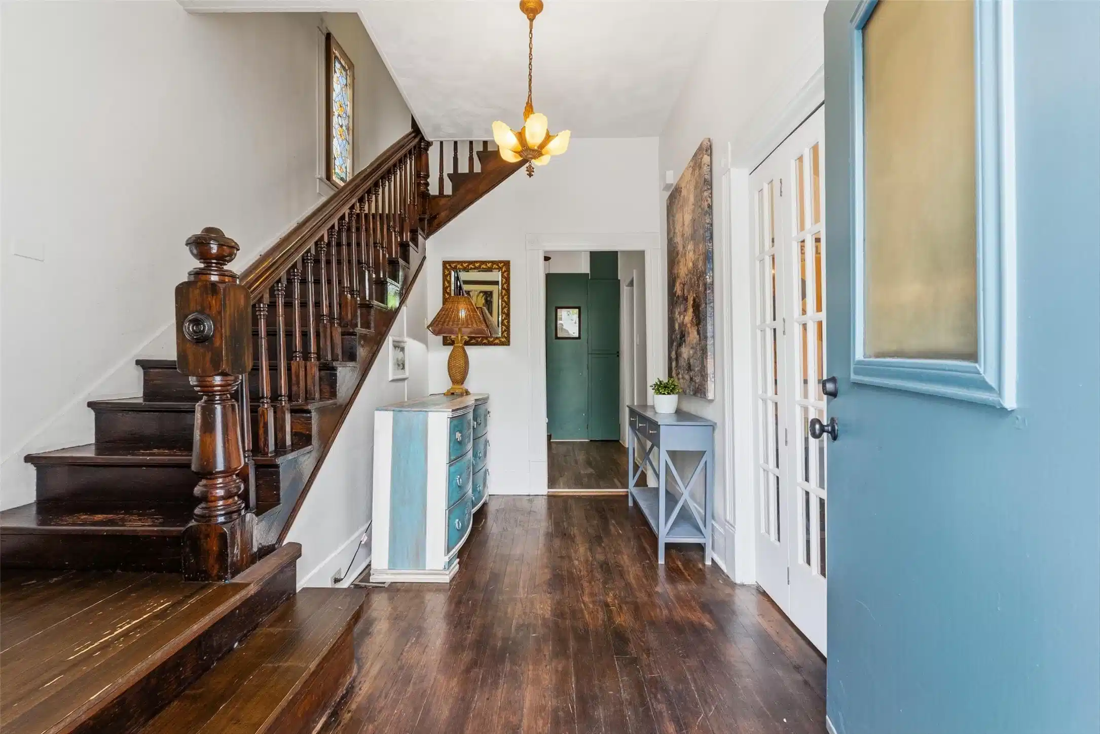 Image 1: Rich original hardwood floors and a beautifully cr