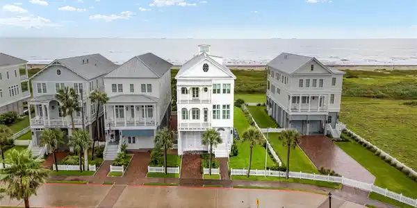 Image 3: Three beachfront lots give this 5,855 SF home room