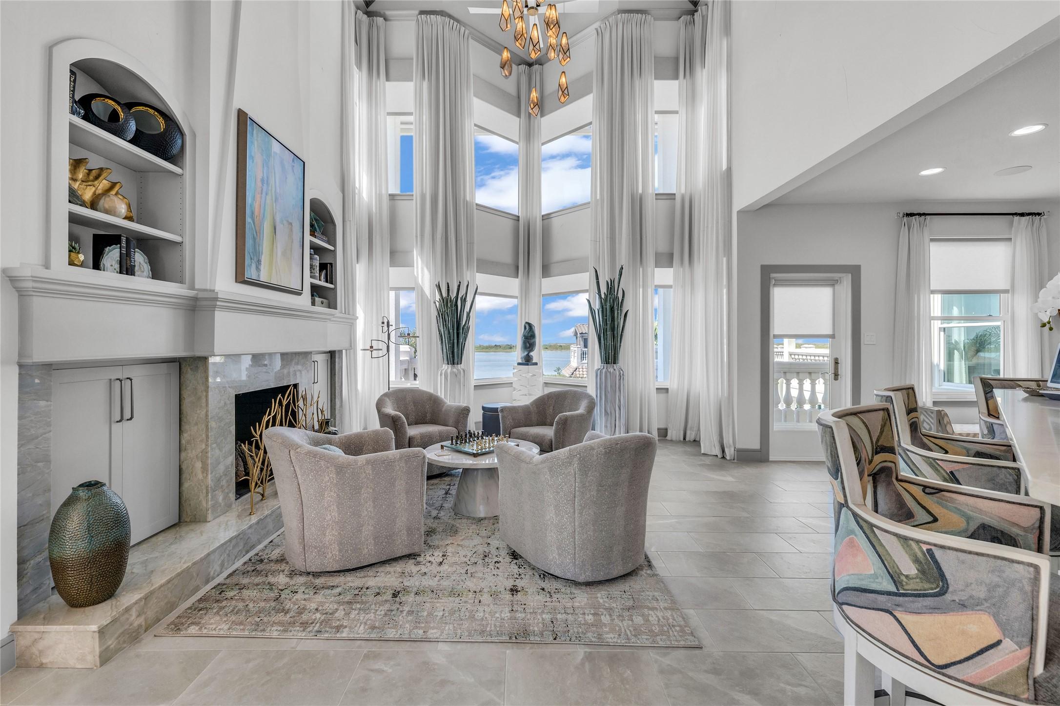 Image 4: Sitting area with water views and fireplace!
