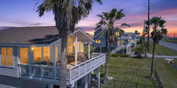 Image 4: Front left side of home at sunset