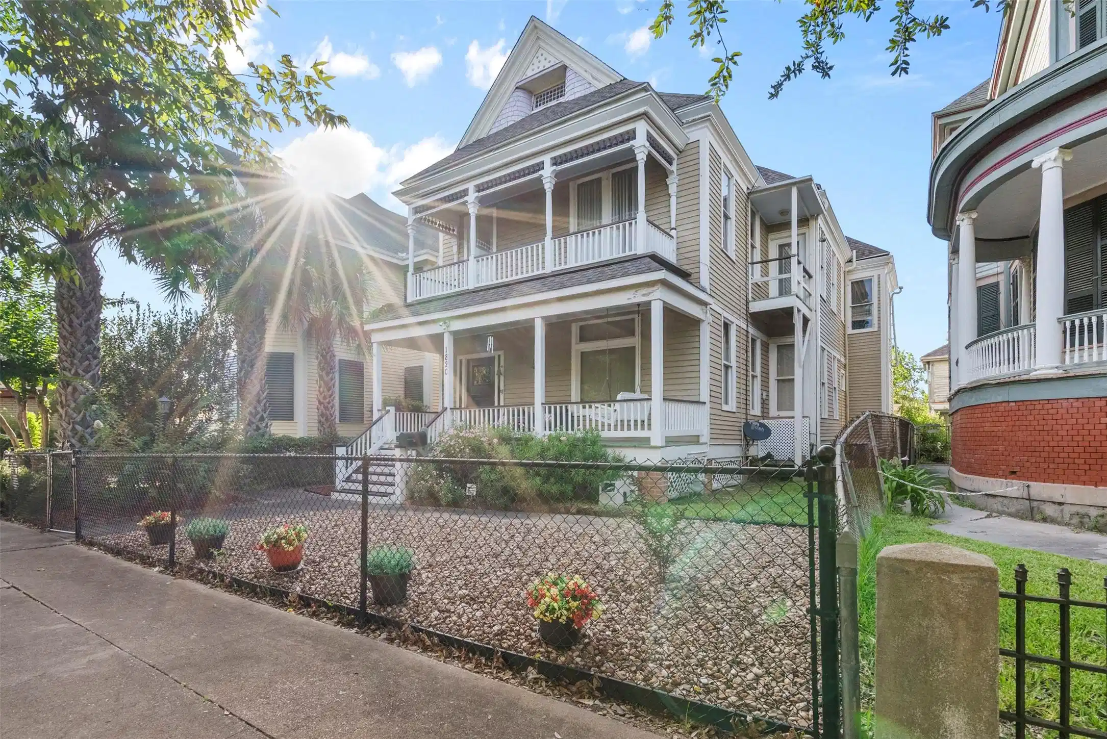 Image 1: Charming Victorian-style home with a welcoming fro