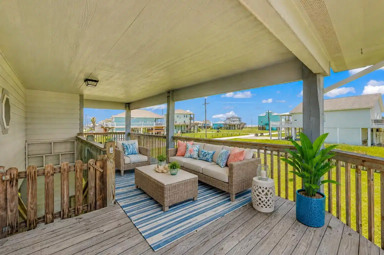 Image 1: The covered wooden deck provides a shaded outdoor