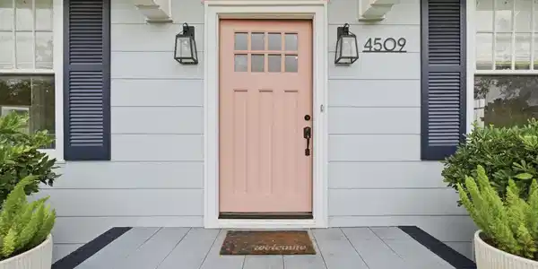 Image 2: Charming front entry featuring a distinctive blush