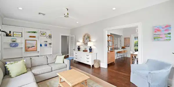 Image 4: Bright and inviting living room featuring hardwood
