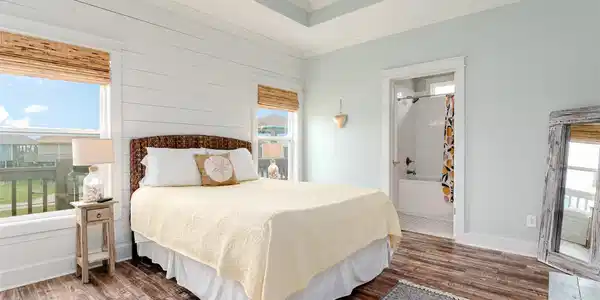 Image 3: Mornings feel brighter in your airy bedroom, where