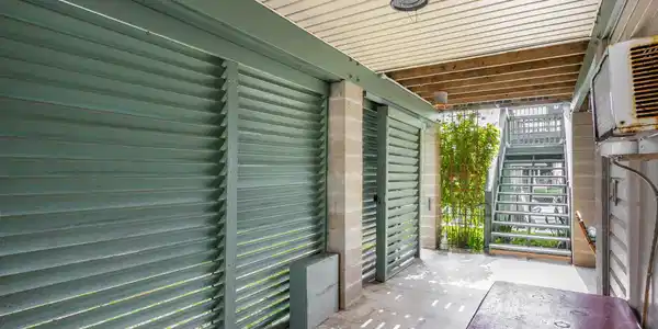 Image 2: Walkway from the front driveway area. Stairs to th