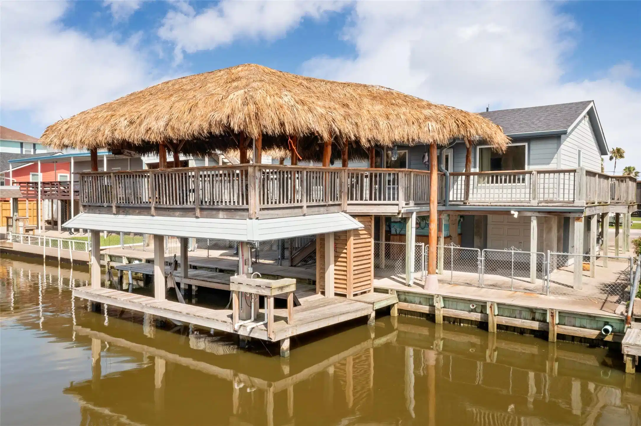 Image 1: Experience waterfront living with this boathouse a