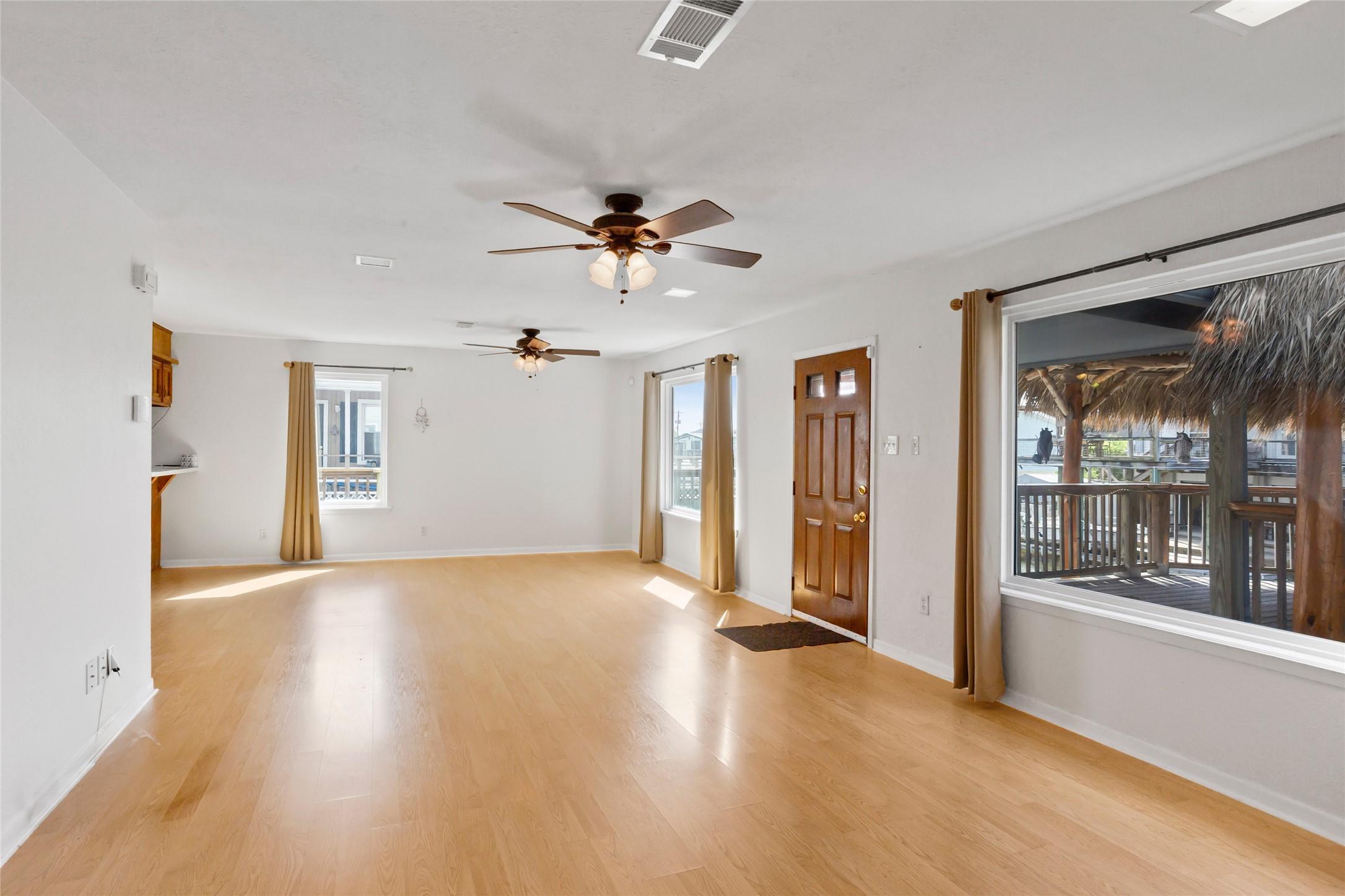 Image 4: Bright and spacious living area with large windows