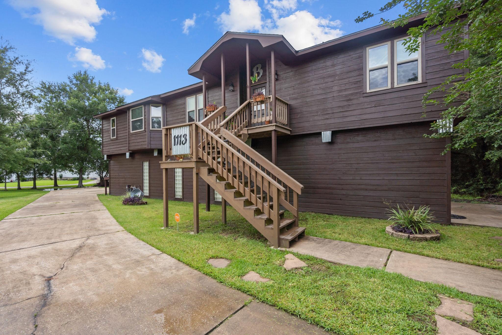 Image 2: This home features a stylish two-story design with