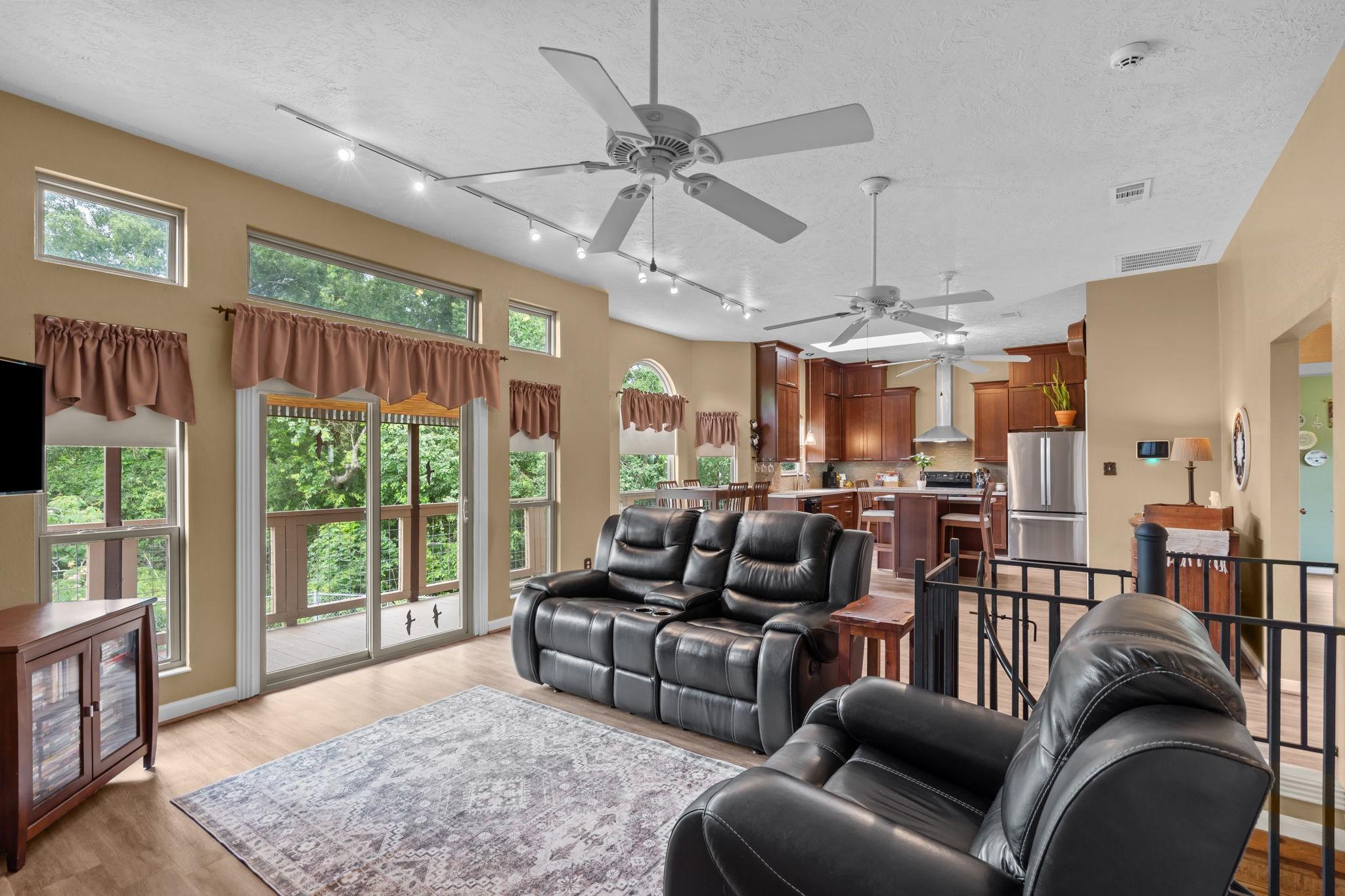 Image 4: Bright and open living space with large windows of