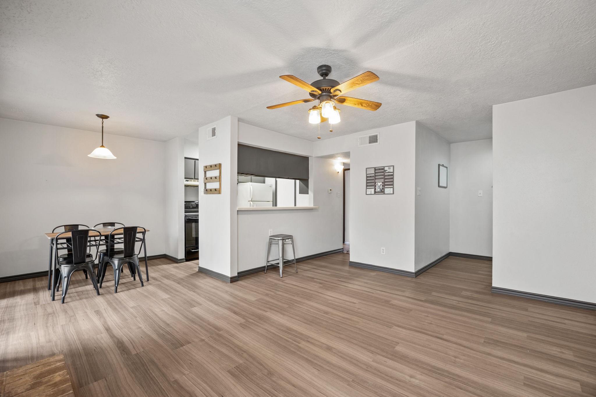 Image 3: Open layout connects living, dining, and kitchen&mdash;p