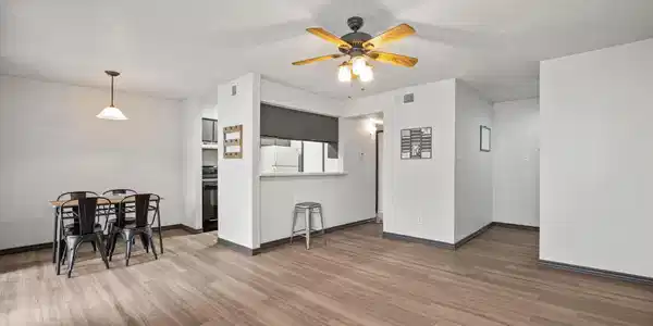 Image 3: Open layout connects living, dining, and kitchen&mdash;p