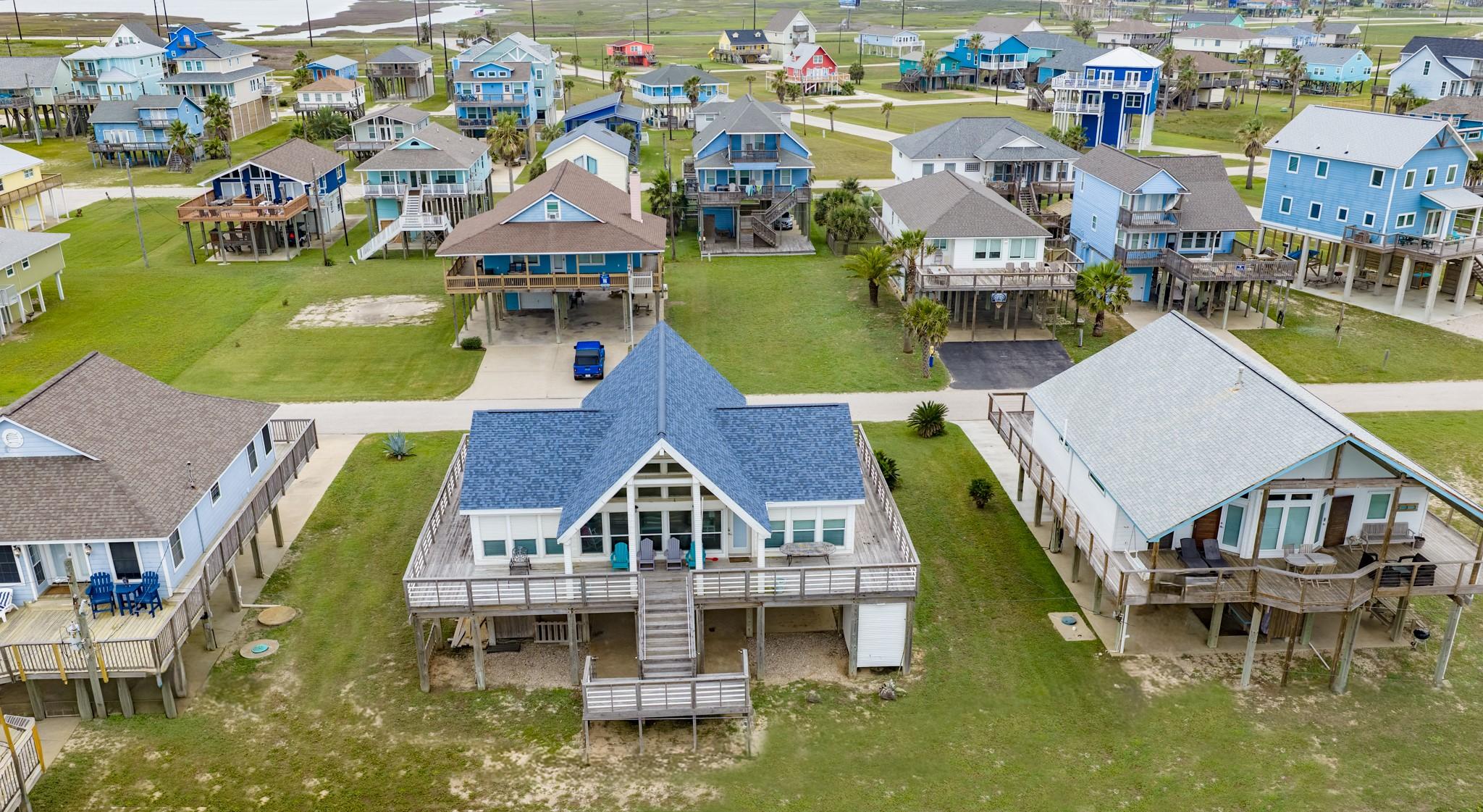 Image 2: Aerial view of this charming beach house