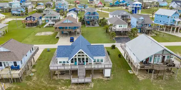 Image 2: Aerial view of this charming beach house