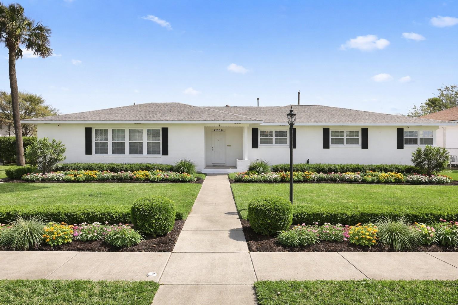 Image 2: Virtually Staged front of home with landscaping