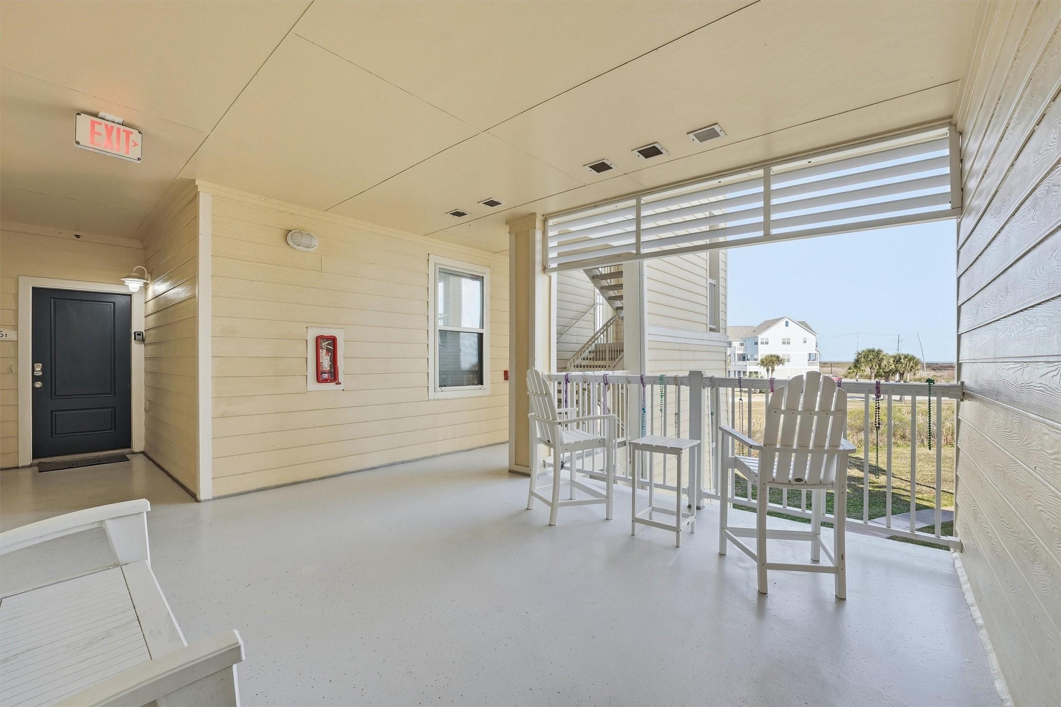 Image 4: A covered breezeway leads you to the front door, o