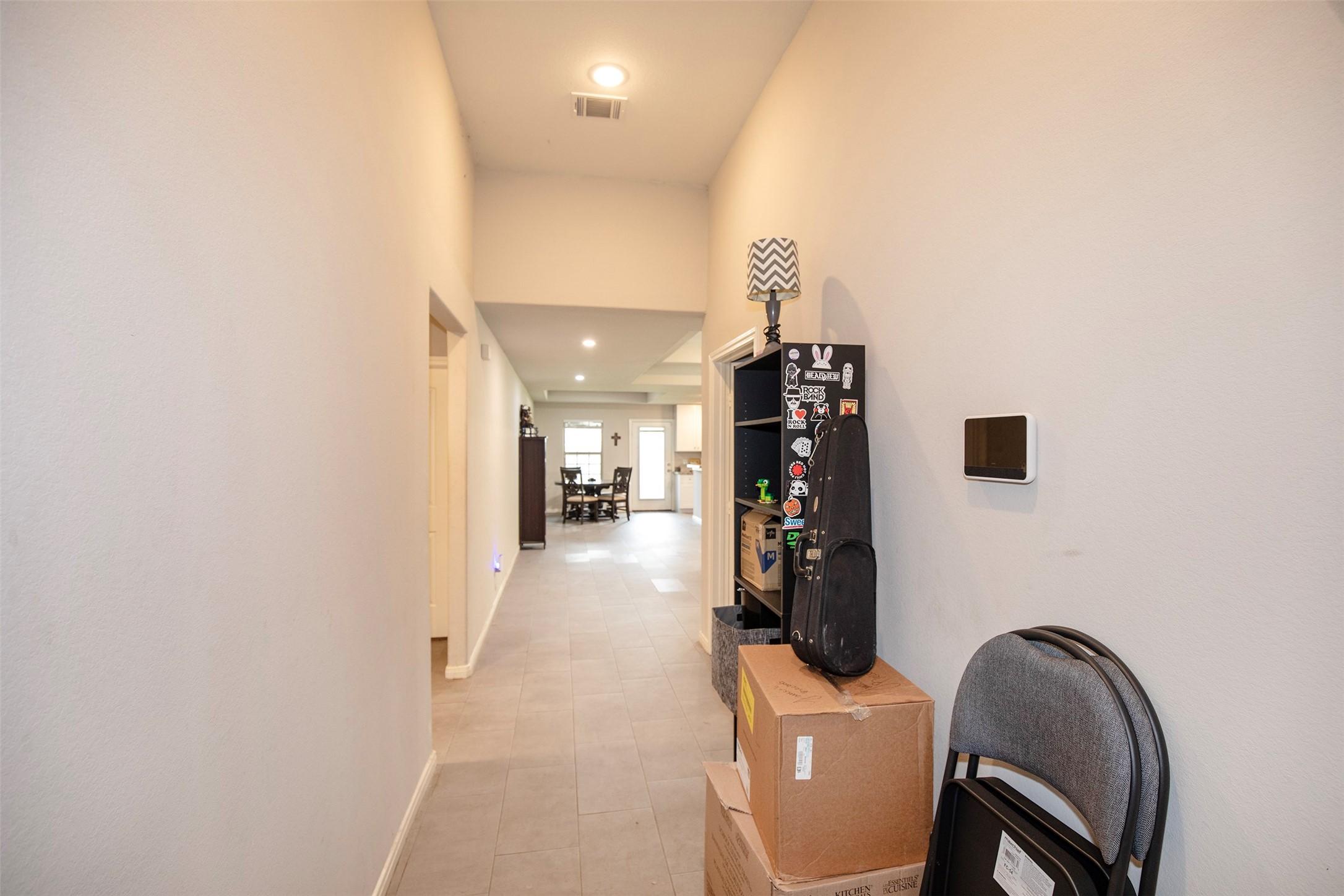 Image 3: bright entryway with easy flow throughout the home
