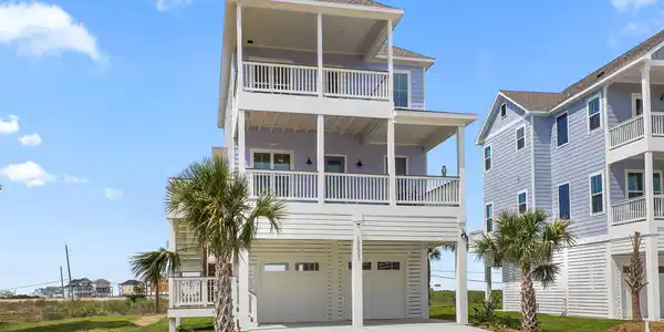 Image 2: This view highlights the home&rsquo;s striking beachside