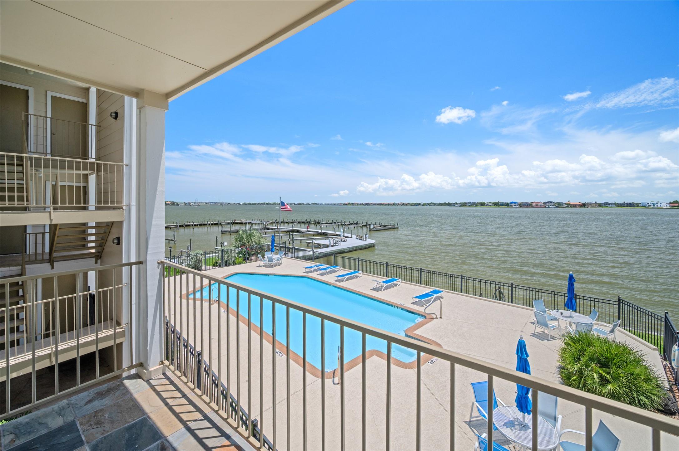 Image 3: Enjoy breathtaking views of the pool, marina, and