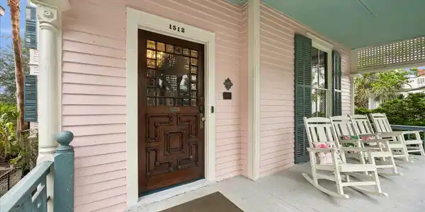 Image 2: Charming front porch was recently restored includi