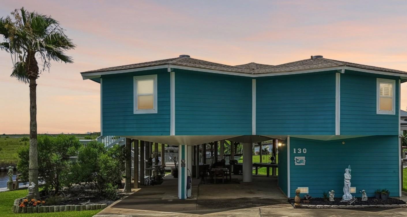 Image 2: Behind this striking waterfront exterior is a home