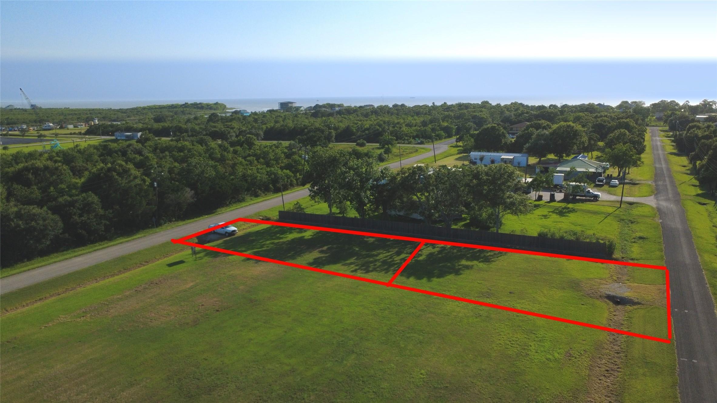 Image 1: Lots are just 2 blocks from the bay and public fis