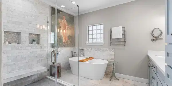 Image 2: Luxury primary bathroom with heated marble floors,