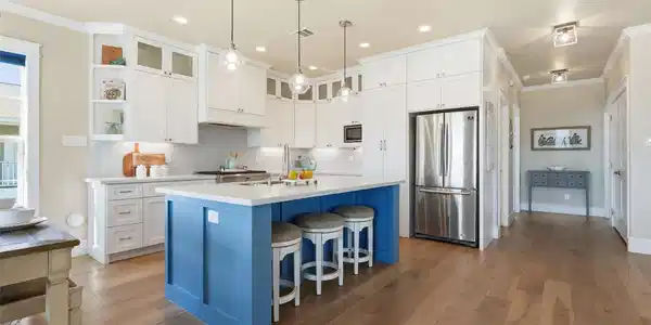Image 2: This kitchen features a bright, open design with w