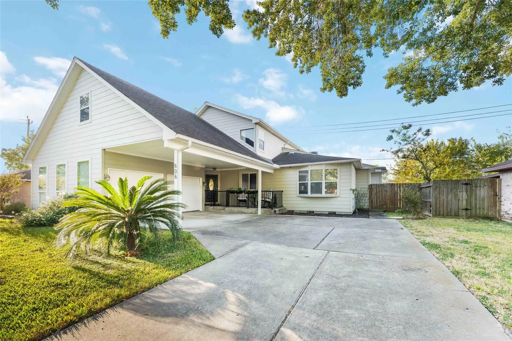 Image 1: This charming two-story home features a modern ext