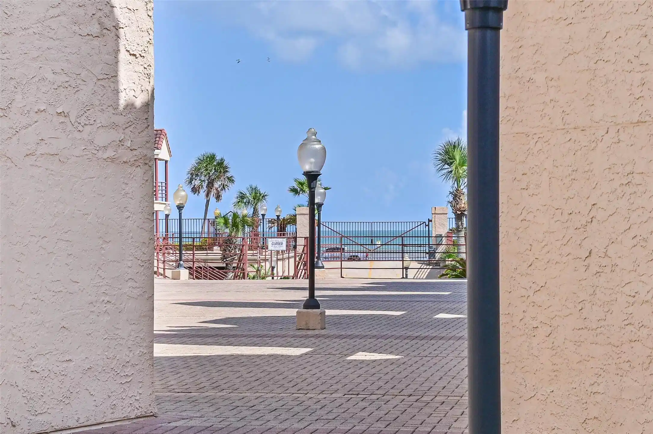 Image 1: Your view of the beach from your spacious patio