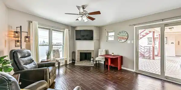 Image 3: Living Room with Cozy Fireplace