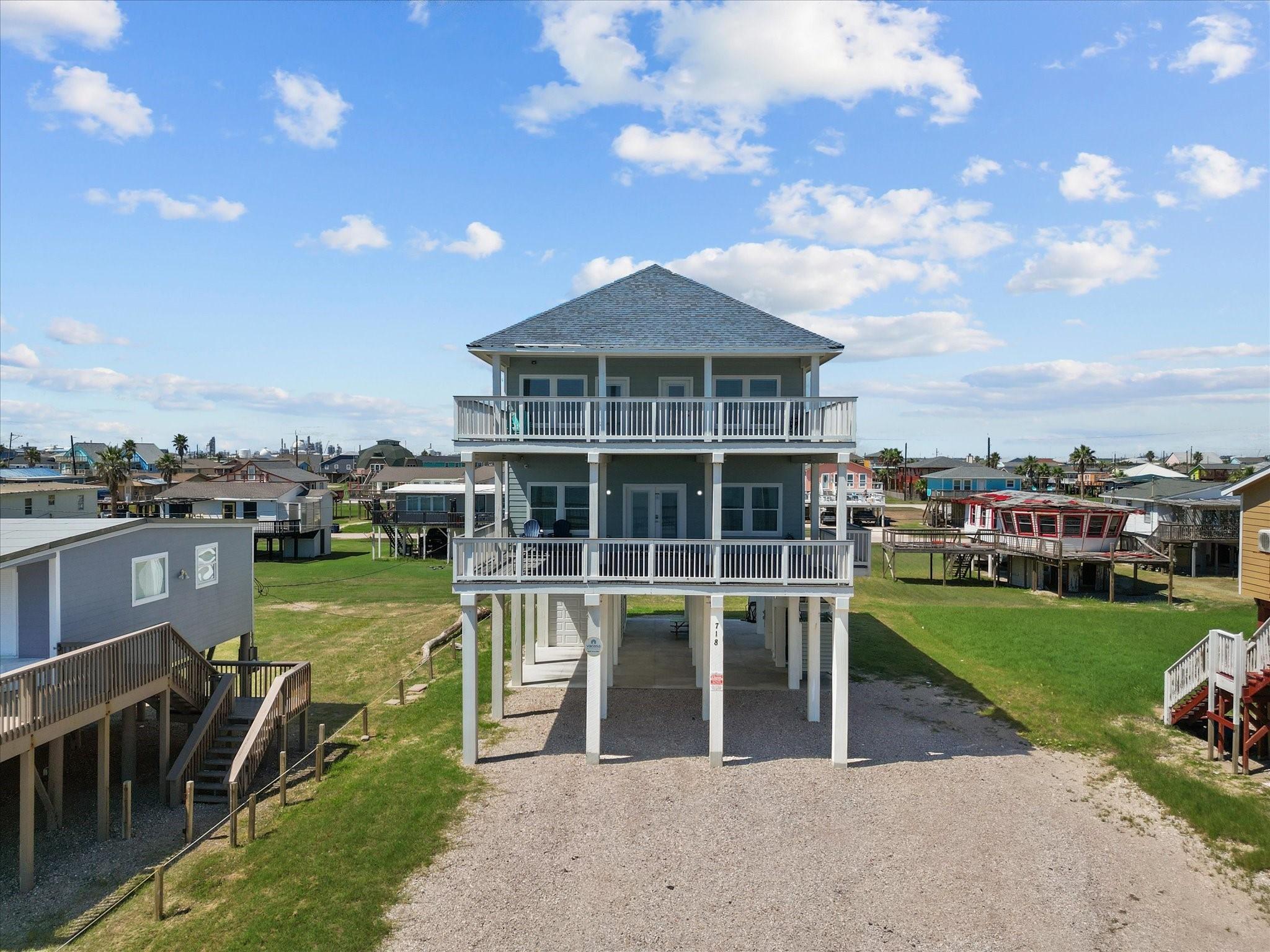 Image 1: Experience coastal living in this charming elevate