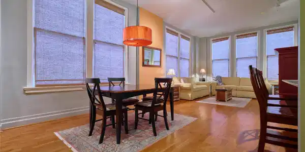 Image 2: Spacious open-plan living area with hardwood floor