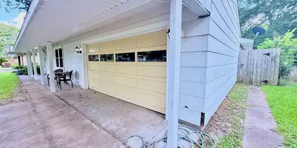 Image 4: Front porch runs the entire width of home. Two car