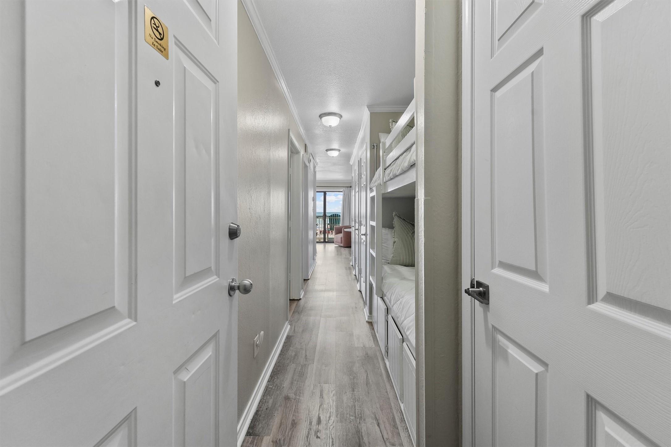 Image 4: A bright hallway welcomes you inside, leading to t