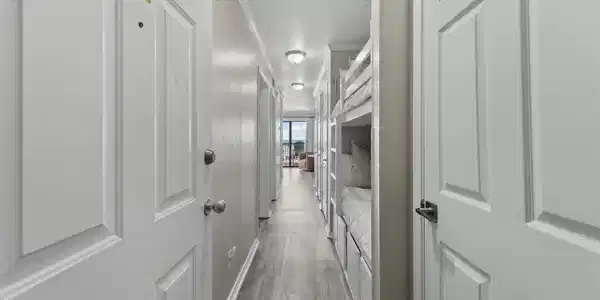 Image 4: A bright hallway welcomes you inside, leading to t