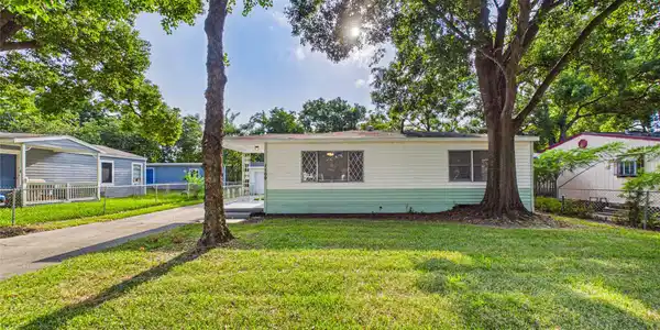 Image 2: Charming single-story home with a spacious front y