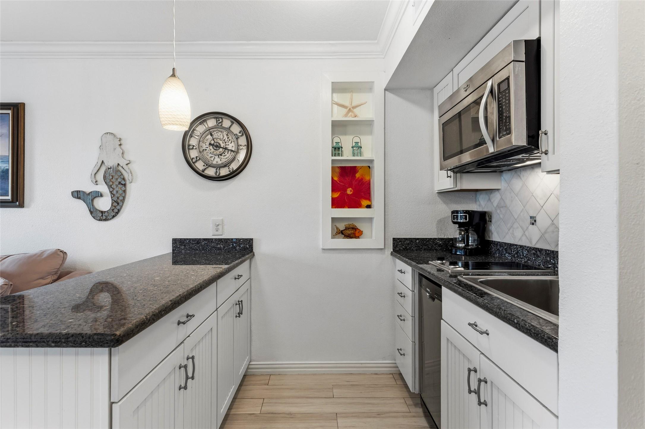 Image 4: Stylish, recently updated kitchen showcasing contr