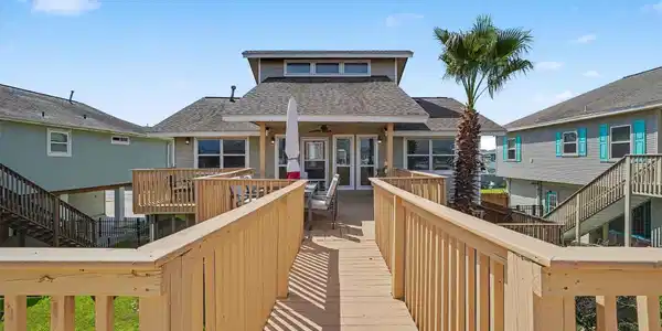 Image 2: View of the water side of the home, from the upper