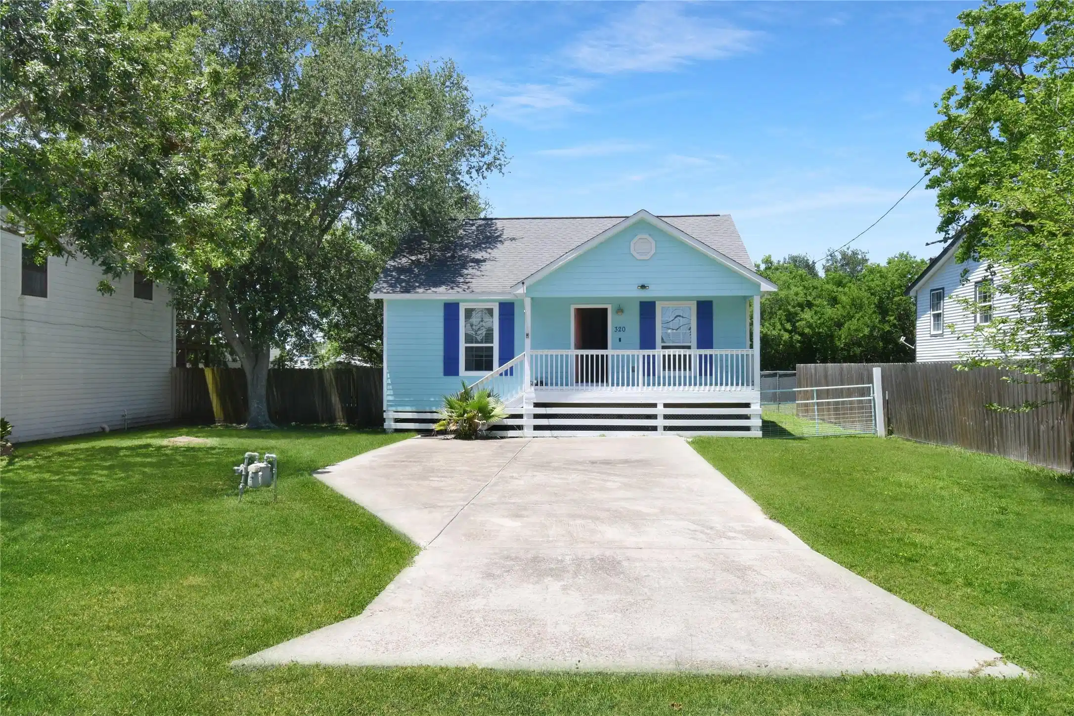 Image 1: This charming home, nestled on a serene street, bo