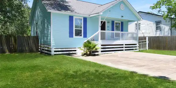 Image 2: Charming corner-view home with a welcoming front p