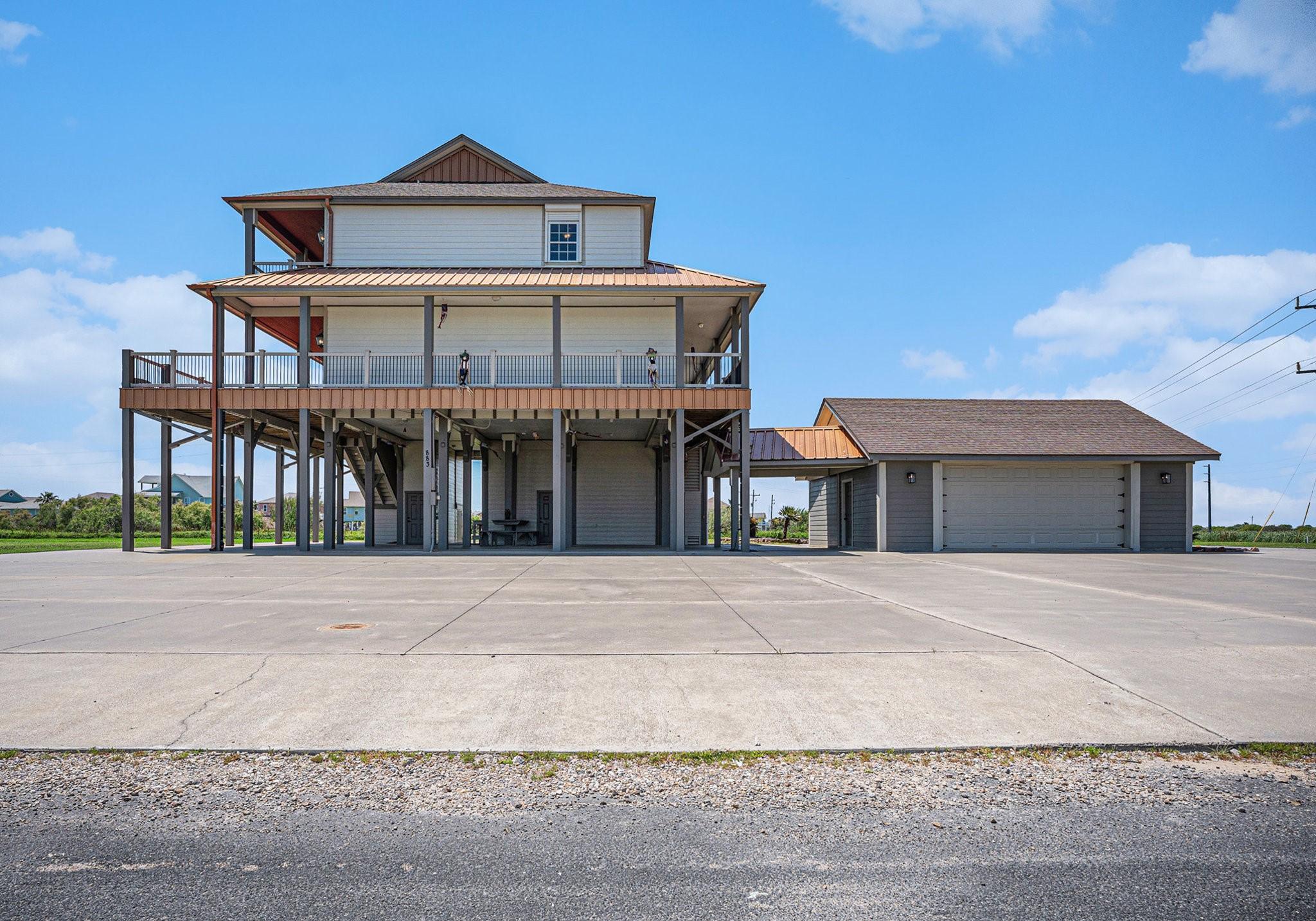 Image 3: This oversized 2-car garage offers ample space and
