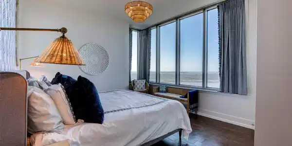 Image 4: Bay views and walls of windows create a restful pr